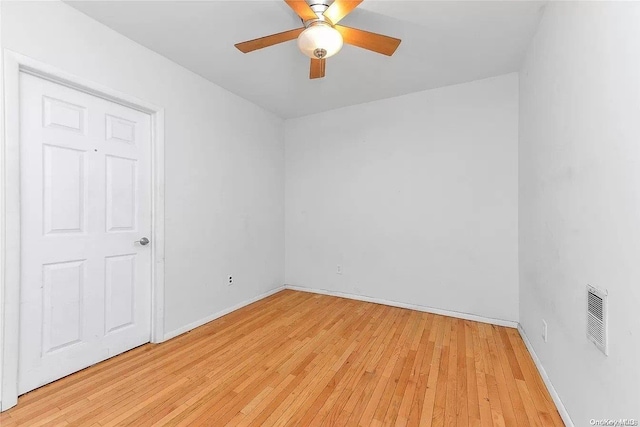 spare room with ceiling fan and light hardwood / wood-style floors