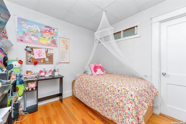 bedroom with hardwood / wood-style floors