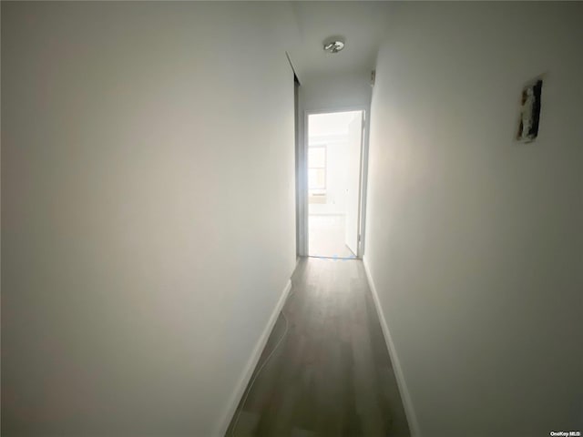 corridor featuring hardwood / wood-style floors