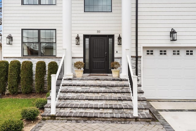 entrance to property featuring a garage