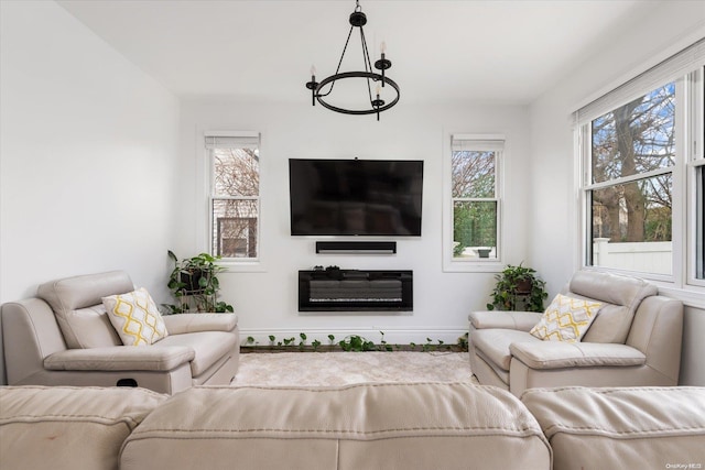 living room featuring an inviting chandelier