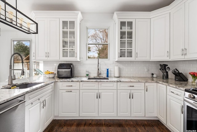 kitchen featuring white cabinetry, sink, and stainless steel appliances