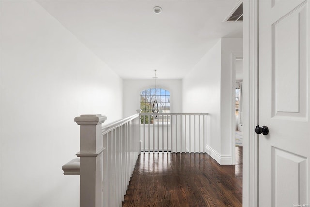 hallway featuring dark hardwood / wood-style flooring