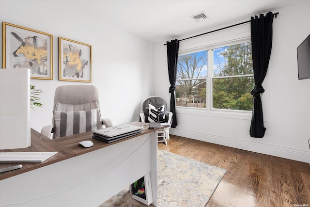 office area with hardwood / wood-style flooring