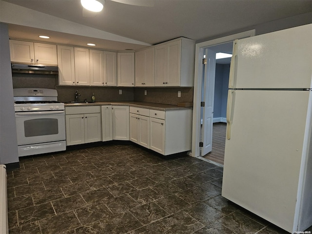 kitchen with sink, white appliances, white cabinetry, and backsplash