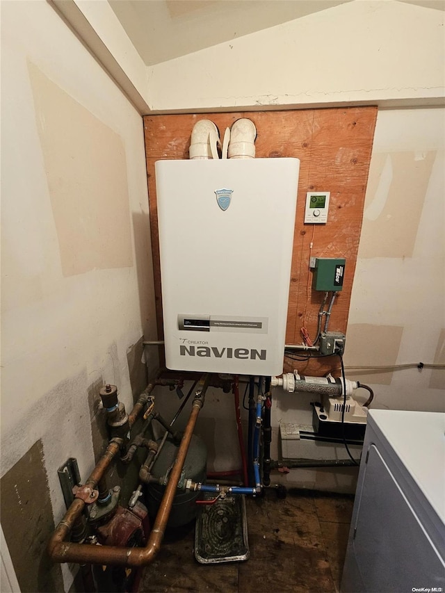 utility room featuring washer / dryer and water heater