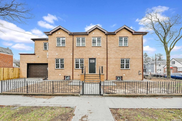 rear view of property featuring a garage