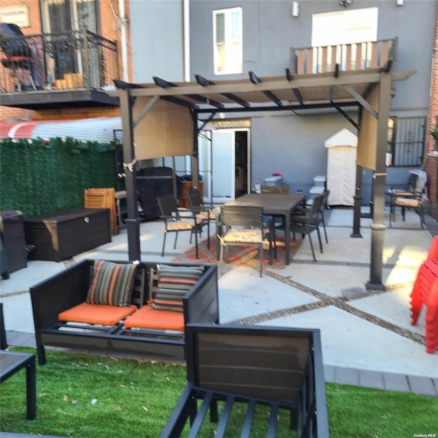 view of patio / terrace with a pergola and an outdoor hangout area