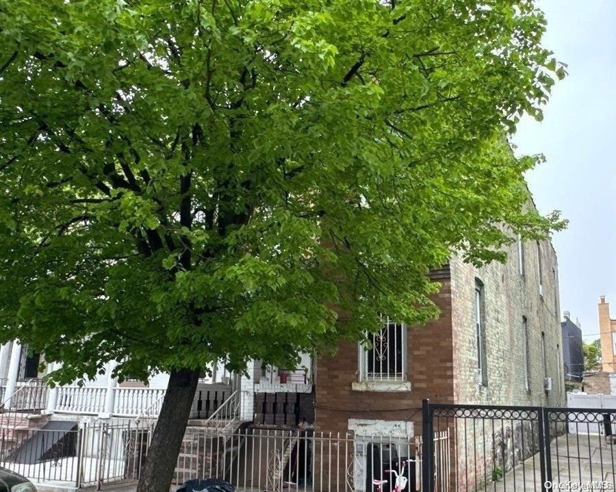 36 Hale Ave, Brooklyn, NY 11208 - view of building exterior with a fenced front yard