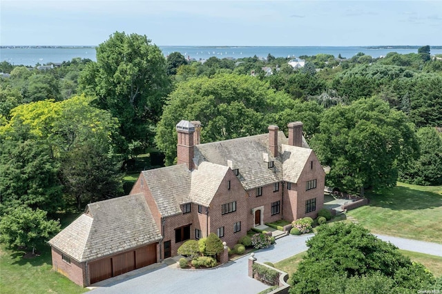 birds eye view of property with a water view