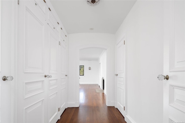 hallway with dark hardwood / wood-style floors