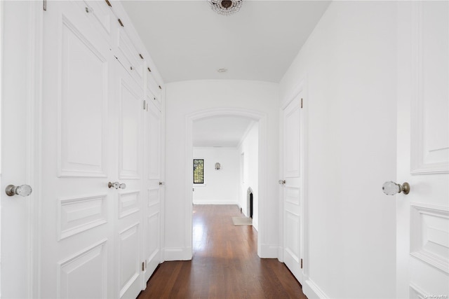 16 Tuthill Ln, Remsenburg, NY 11960 - corridor with dark wood-style floors and arched walkways