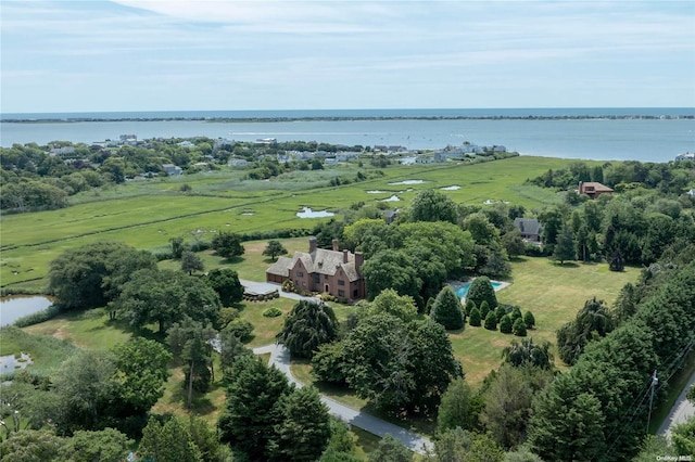 drone / aerial view featuring a water view and a rural view