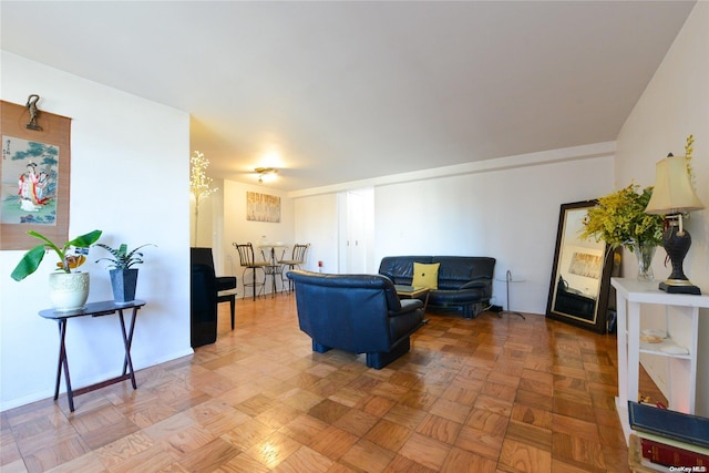 living room featuring parquet flooring