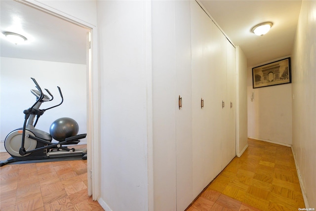 corridor with light parquet floors