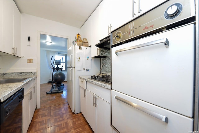 kitchen featuring white cabinetry, sink, tasteful backsplash, ventilation hood, and white appliances