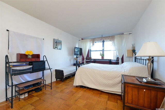 bedroom with wood-type flooring