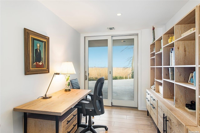 office with light hardwood / wood-style floors