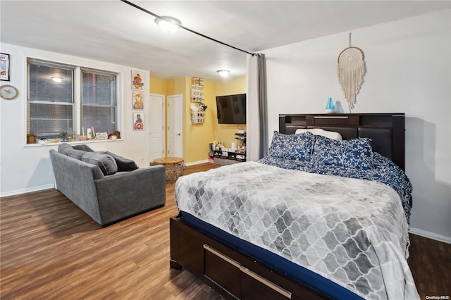 bedroom featuring hardwood / wood-style flooring