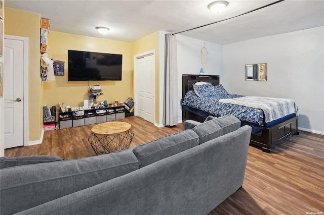 bedroom with hardwood / wood-style flooring