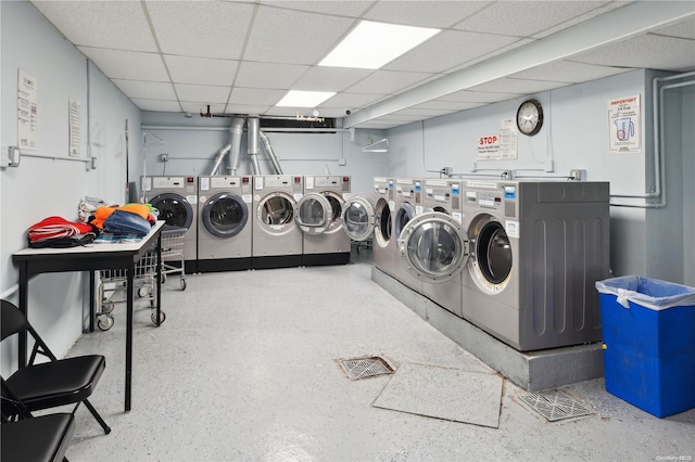 clothes washing area with washer and clothes dryer