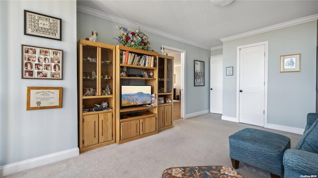 sitting room with light colored carpet and crown molding