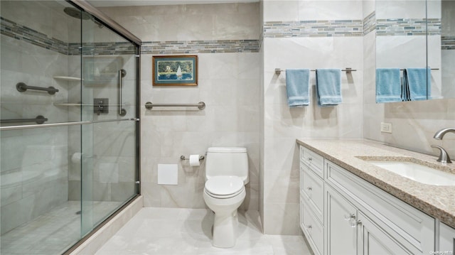 bathroom featuring vanity, toilet, tile walls, and walk in shower