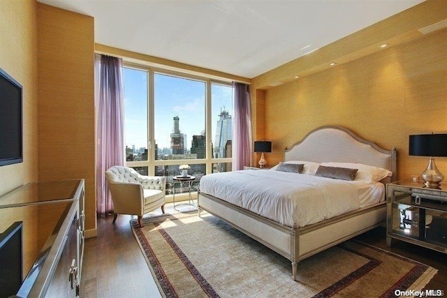 bedroom featuring dark hardwood / wood-style flooring