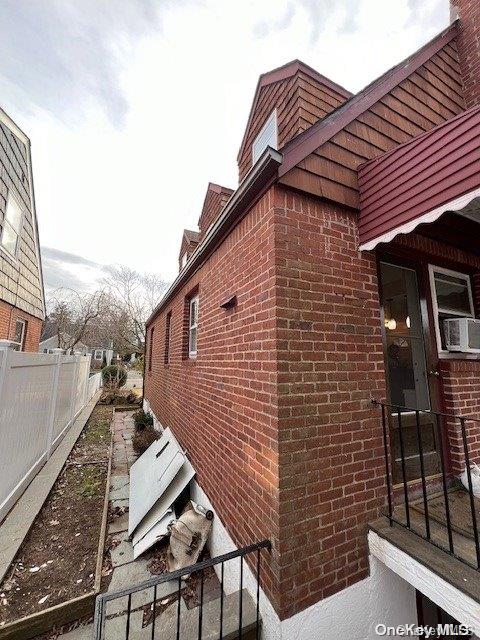 view of side of property with cooling unit