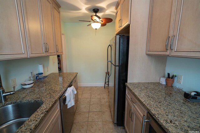 kitchen featuring sink, ceiling fan, light stone countertops, light tile patterned floors, and stainless steel appliances