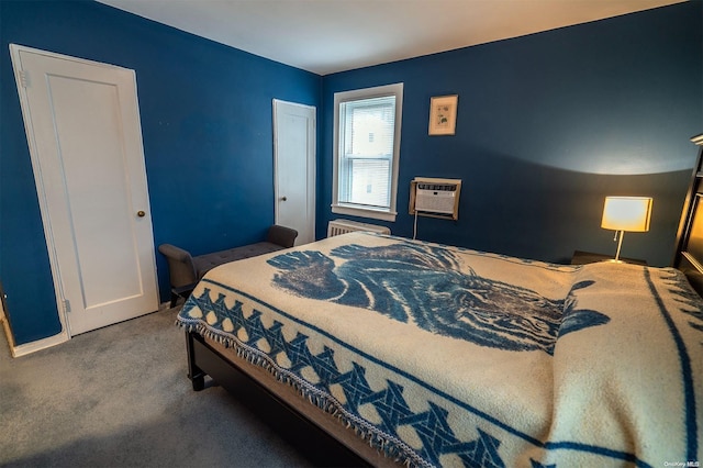 carpeted bedroom with an AC wall unit