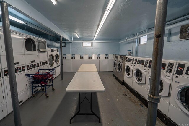 laundry area featuring a healthy amount of sunlight, independent washer and dryer, and stacked washer and clothes dryer