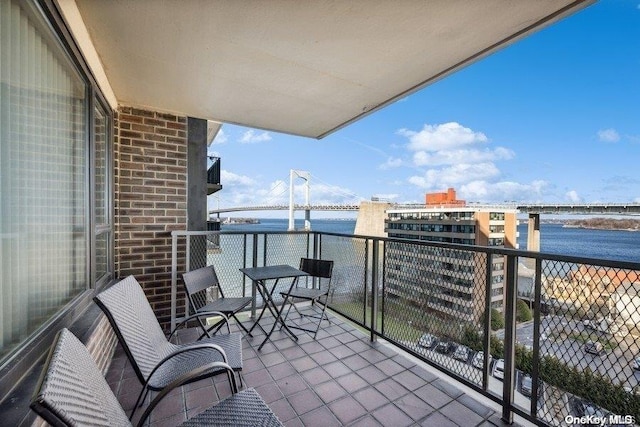 balcony featuring a water view