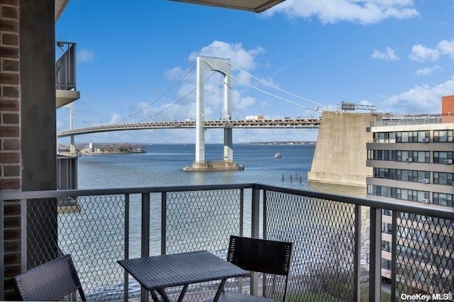 balcony featuring a water view