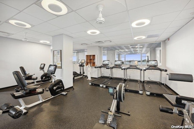 exercise room with a paneled ceiling