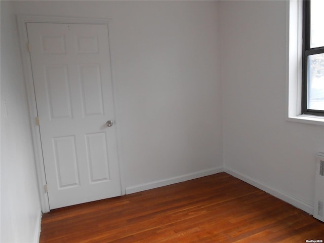 empty room featuring wood-type flooring