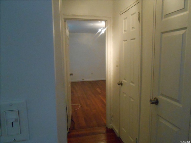 hallway featuring dark wood-type flooring