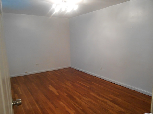 empty room featuring dark hardwood / wood-style floors