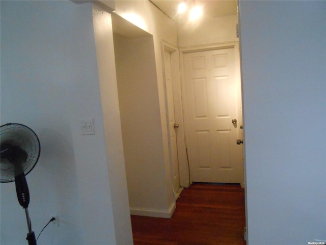 hallway featuring dark wood-type flooring