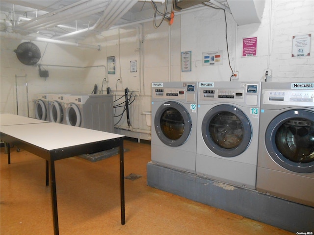 clothes washing area with independent washer and dryer