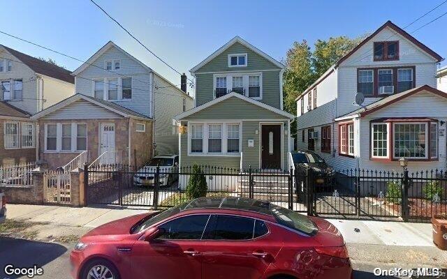 110-16 160th St, Jamaica, NY 11433 - view of front of house featuring a fenced front yard and a gate