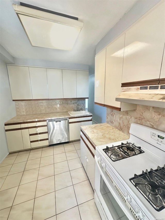 kitchen with decorative backsplash, sink, light tile patterned floors, dishwasher, and white range with gas stovetop