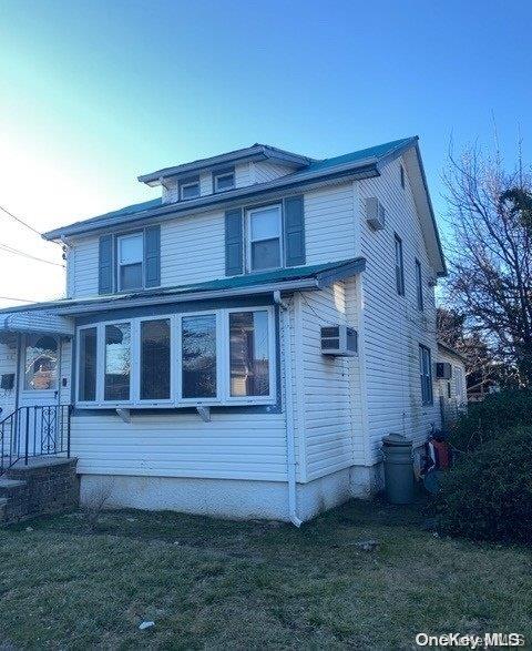 view of property exterior featuring a yard