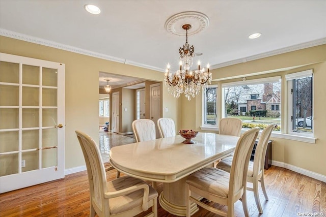 4 Midfarm Rd, Rockville Centre, NY 11570 - dining room featuring a chandelier, ornamental molding, light wood finished floors, and recessed lighting