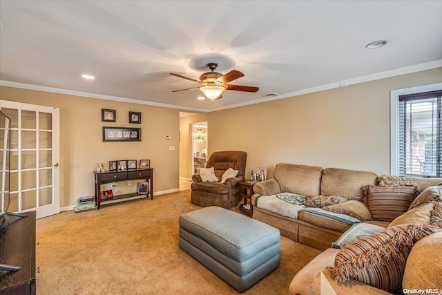 carpeted living room featuring ceiling fan and crown molding