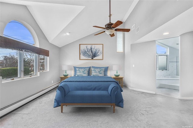 bedroom with light carpet, ensuite bath, baseboard heating, and ceiling fan