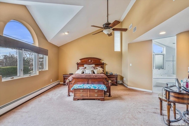 bedroom with connected bathroom, ceiling fan, baseboard heating, light colored carpet, and vaulted ceiling