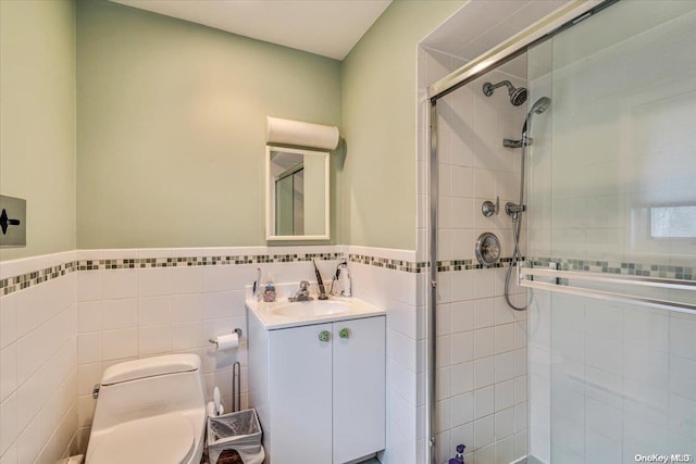 bathroom featuring an enclosed shower, toilet, and tile walls