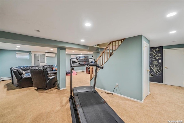 exercise room featuring light carpet, electric panel, a baseboard radiator, and a wall unit AC