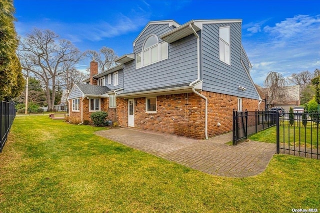 exterior space with a patio area and a yard